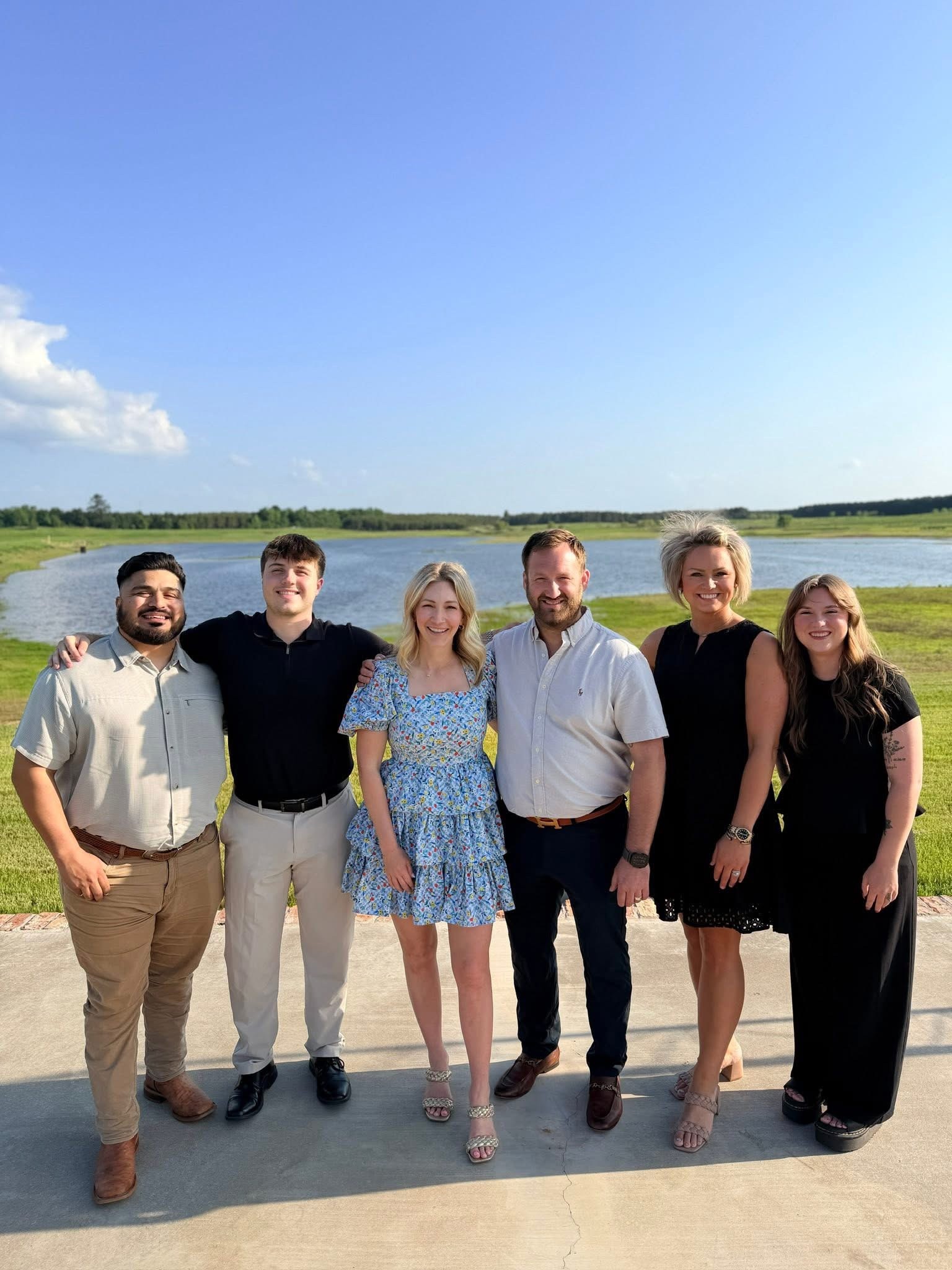 The Pace Insurance Agency team outdoors beside a lake